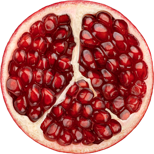 close up of a pomegranate cut in half, showcasing its vibrant seeds that can be used as ingredients in beverages and other manufacturing processes