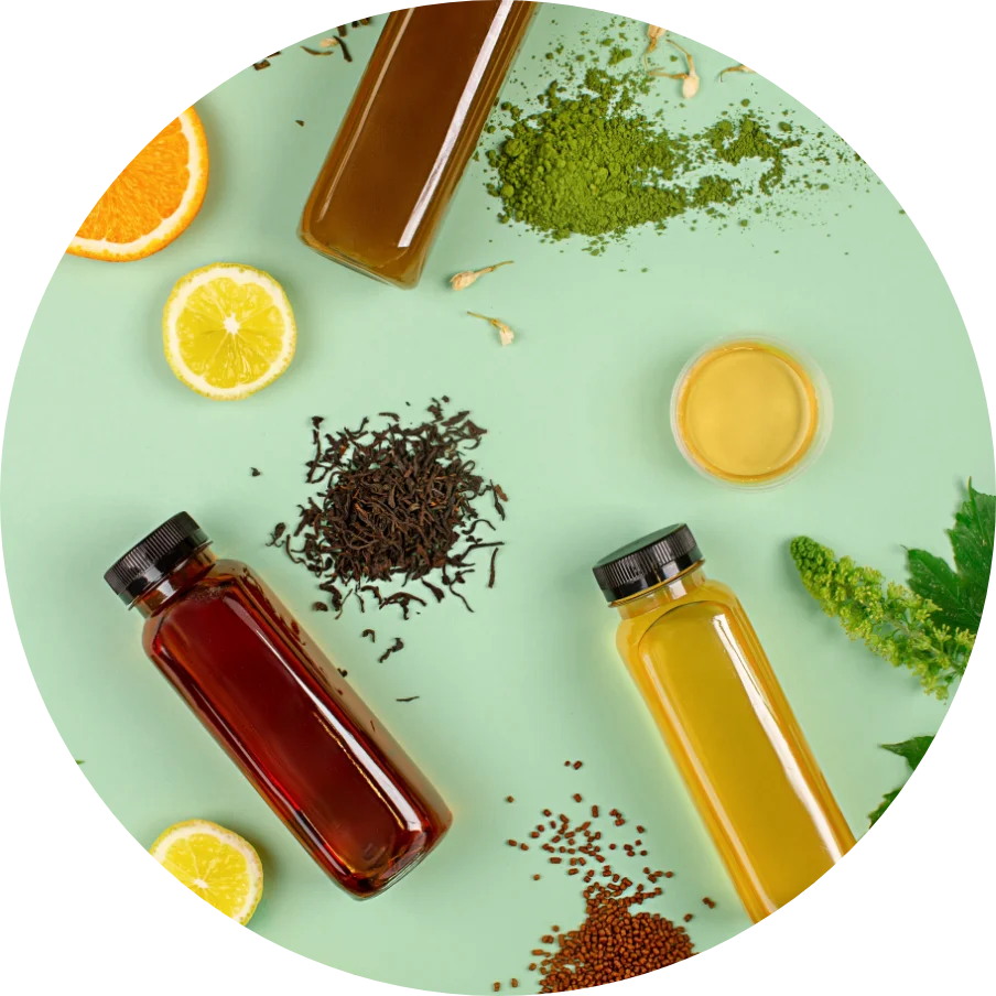 group of bottles filled with different types of beverages and ingredients