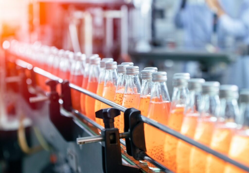 Beverage factory production line fruit juice beverage product at conveyor belt