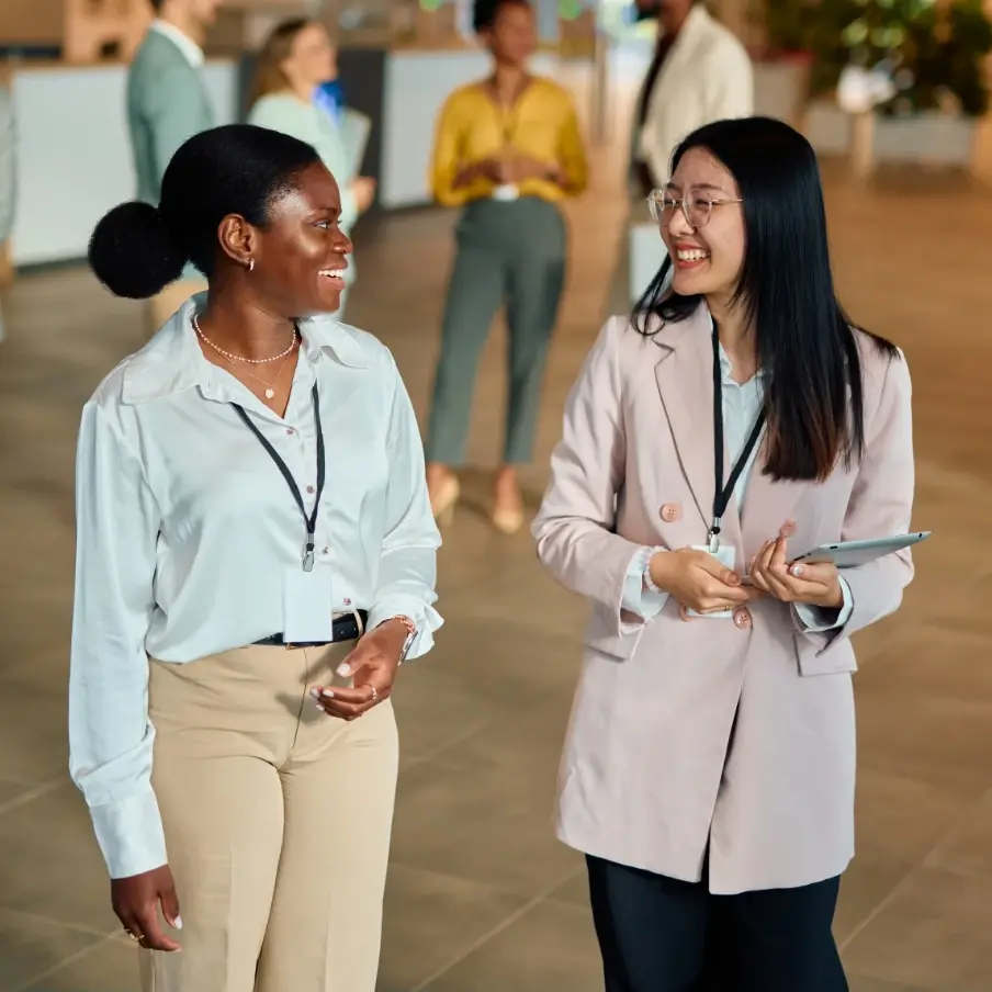 couple of women standing next to each other