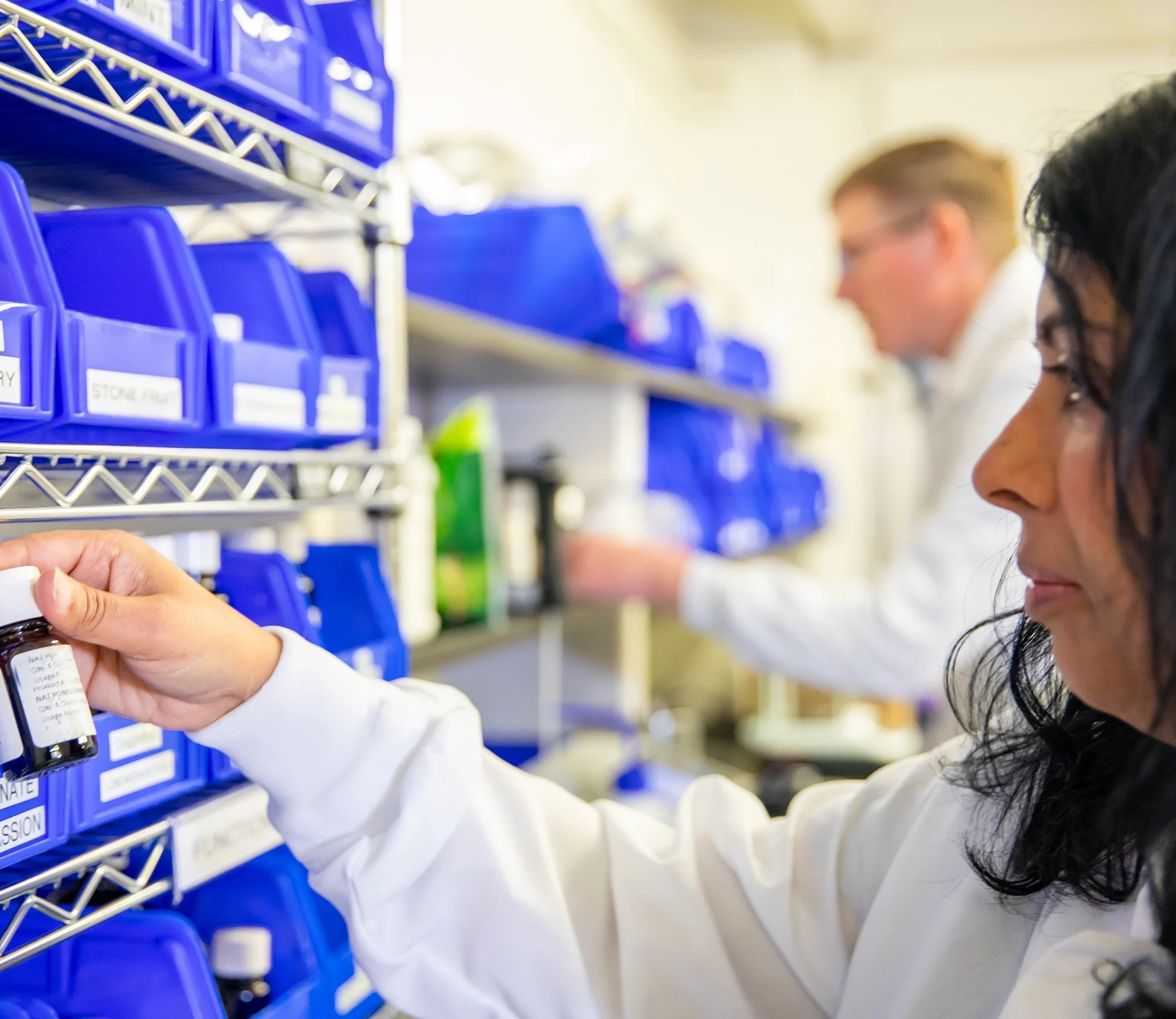 Two food scientists from Vibrant Ingredients working on a new product formulation together in a laboratory