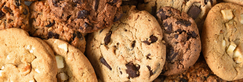 Assorted bakery cookies including chocolate chip, oatmeal raisin, and white chocolate varieties for bakery ingredient applications.